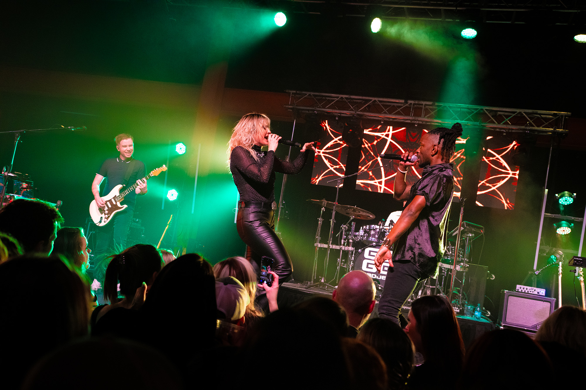 Go Go Gadjet performing live under stage lights